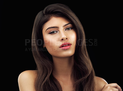 Buy stock photo Studio shot of a beautiful woman posing against a black background