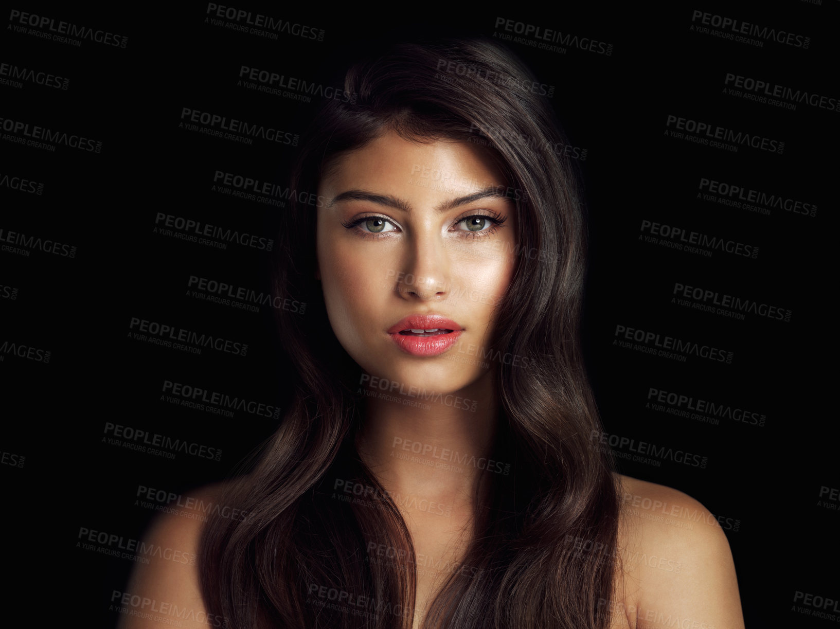 Buy stock photo Studio shot of a beautiful woman posing against a black background