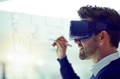 Buy stock photo Shot of a businessman wearing a VR headset while drawing on a glass wall in an office