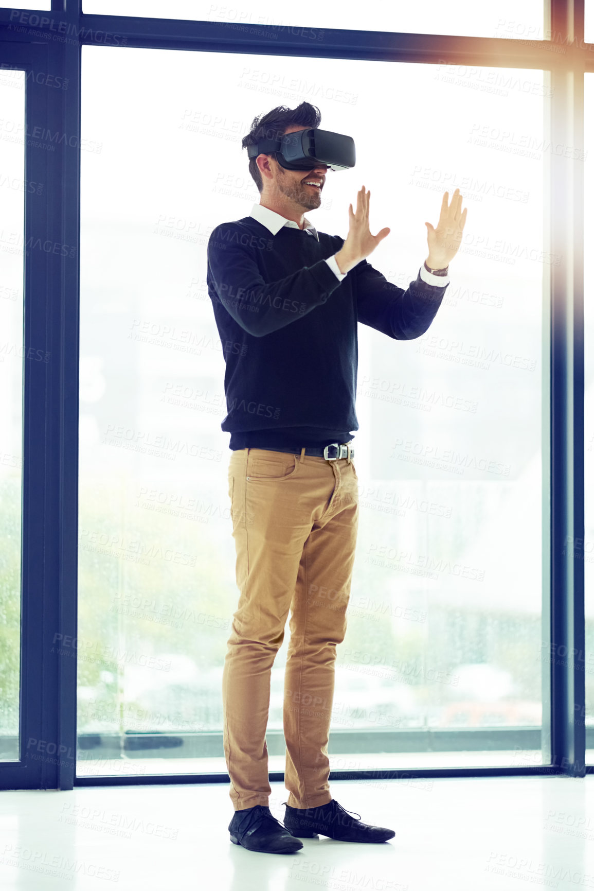 Buy stock photo Shot of a businessman wearing a VR headset in an office