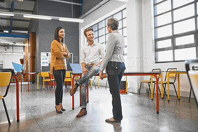 Buy stock photo Full length shot of three creative business colleagues chatting in their office