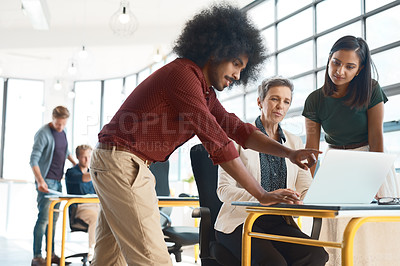 Buy stock photo Shot of a group of creative designers hard at work in their modern office