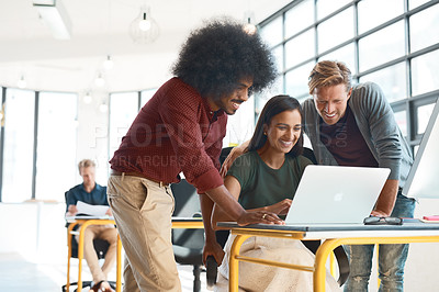 Buy stock photo Shot of a group of creative designers hard at work in their modern office