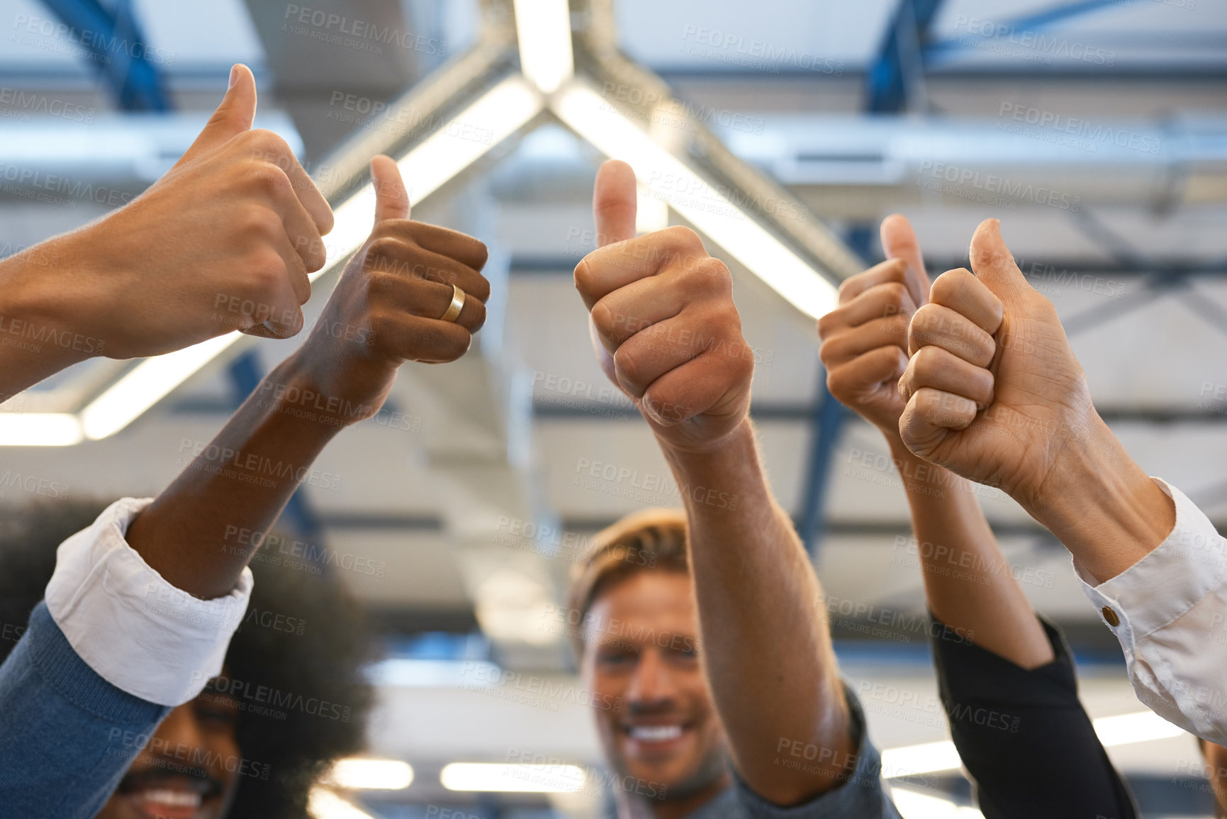Buy stock photo Cropped shot of a group of designers giving you the thumbs up in their office