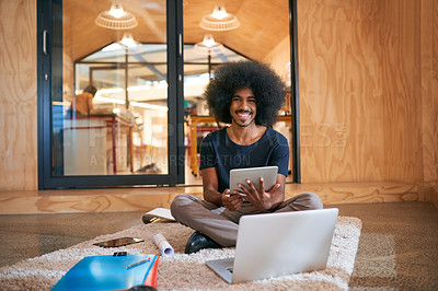 Buy stock photo Portrait of a young designer working on the floor in an office