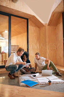 Buy stock photo Creative people, tech and meeting with paperwork in discussion for architecture, research and idea. Interior design, team and men with documents on floor for project plan, brainstorming and review