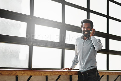 Buy stock photo Window, smile and phone call with a business man talking in the office while networking for negotiation. Happy, mobile and communication with a happy male employee standing at work during his break