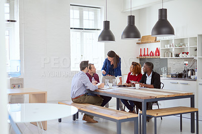 Buy stock photo Shot of an attractive young businesswoman addressing her team during a meeting