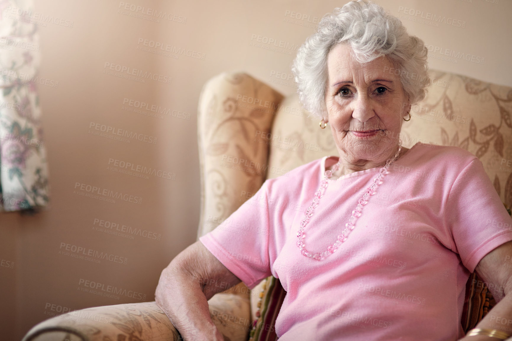 Buy stock photo Portrait of a senior woman relaxing on a chair at home
