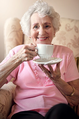 Buy stock photo Portrait of a senior woman enjoying a warm beverage at home