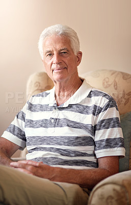 Buy stock photo Portrait of a senior man relaxing on a chair at home