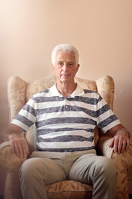 Buy stock photo Portrait of a senior man sitting on a chair at home
