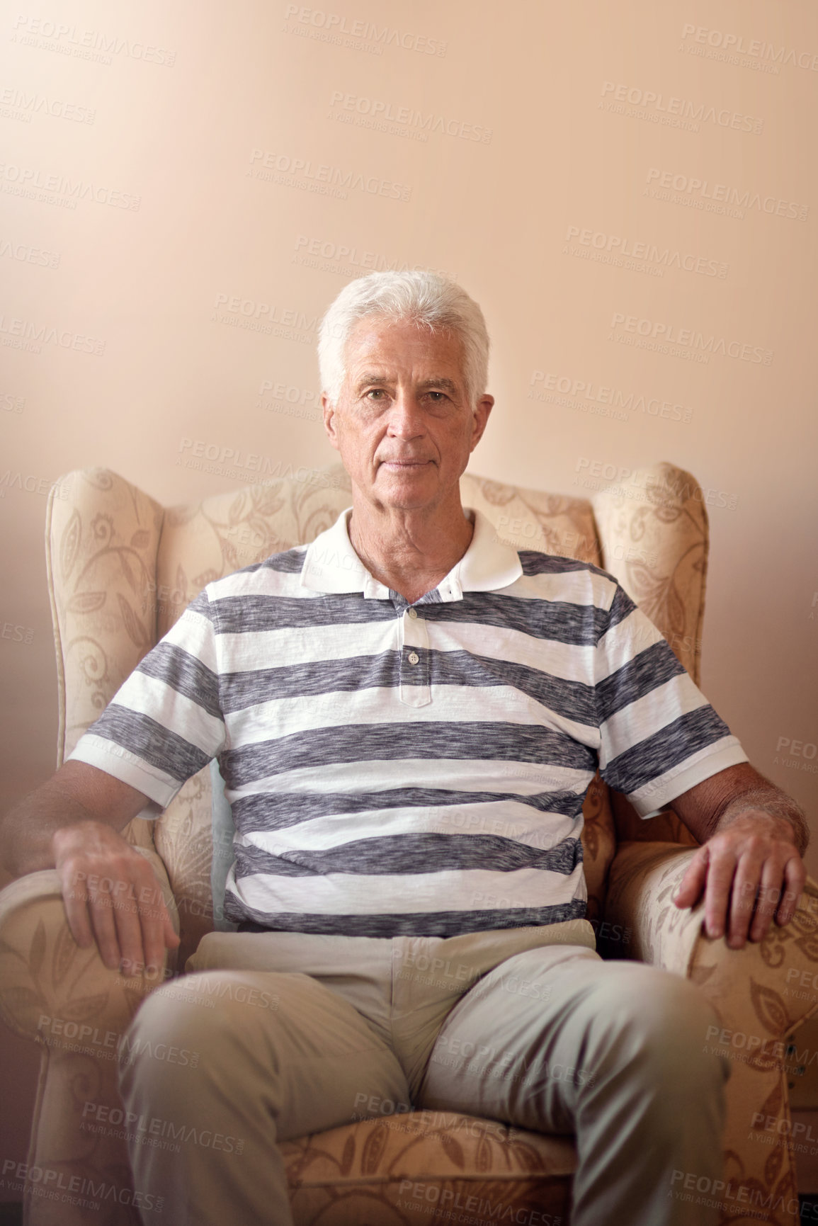 Buy stock photo Portrait of a senior man sitting on a chair at home