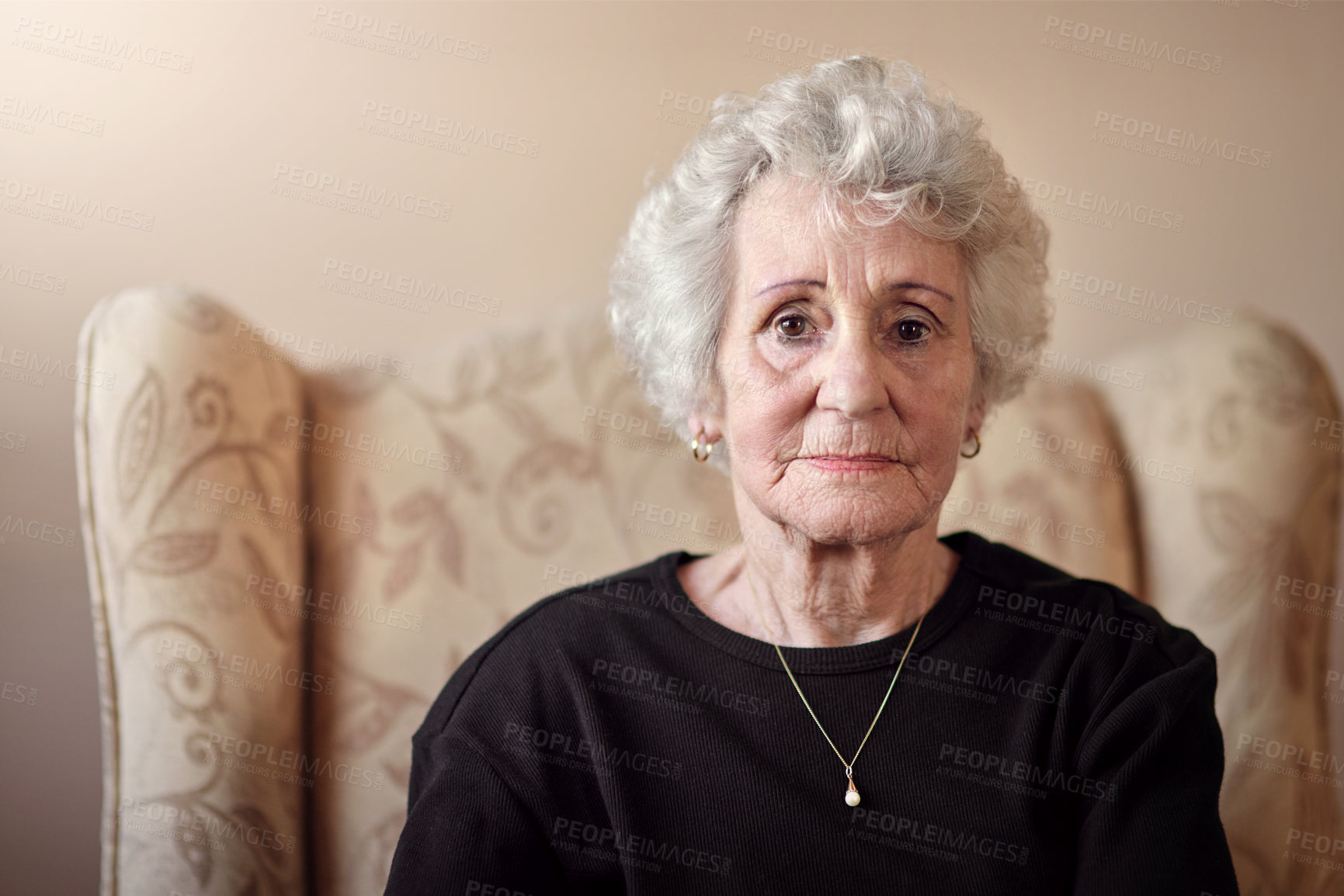 Buy stock photo Portrait of a senior woman sitting on a chair at home