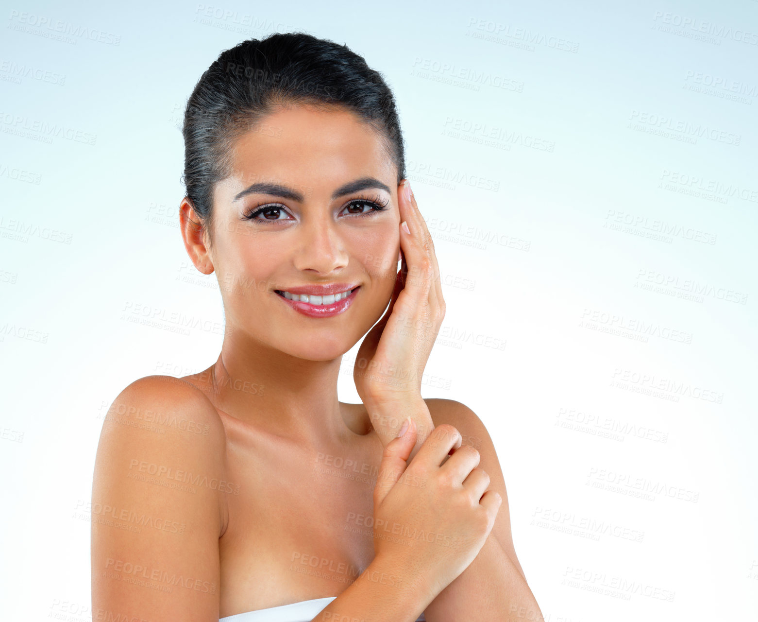 Buy stock photo Studio shot of a beautiful young woman posing against a blue background