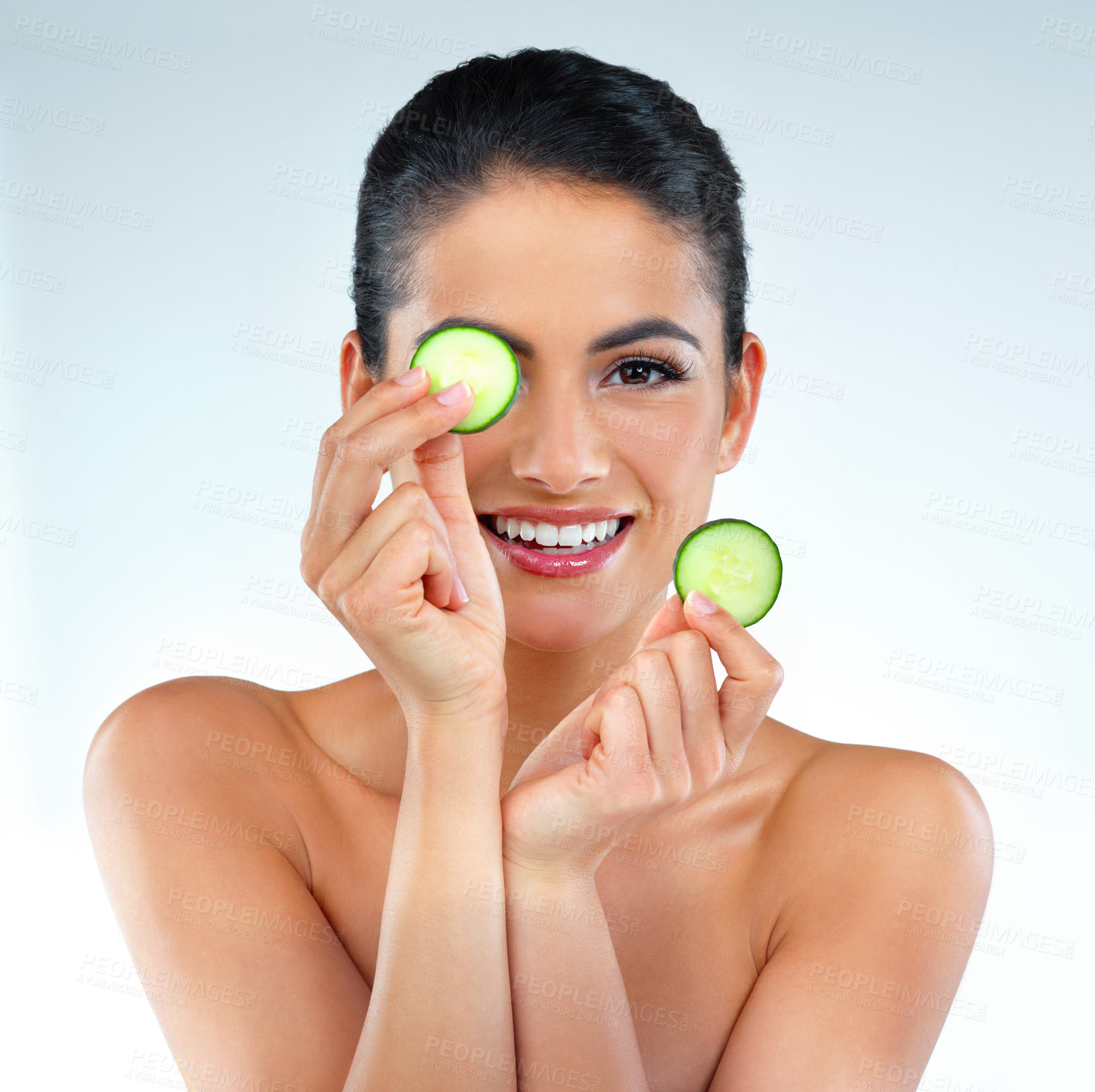 Buy stock photo Cucumber, skincare and portrait of woman in studio with natural, revitalizing or face routine. Smile, beauty and person with vegetable for facial dermatology treatment for glow by white background.