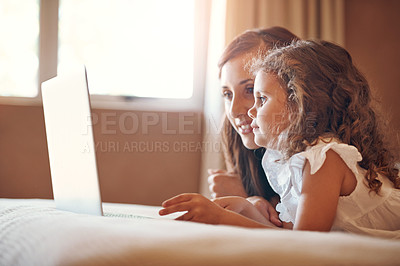 Buy stock photo Mother, child and laptop on bed in home for streaming subscription, cartoon and watching online video. Happy family, woman and girl in bedroom with technology for social media, bonding and kid film