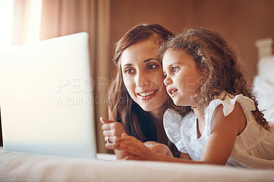 Buy stock photo Mother, kid and laptop on bed in home for streaming subscription, cartoon and watching online video. Happy family, woman and girl in bedroom with technology for social media, bonding and child film