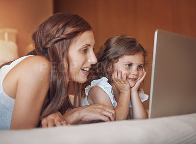 Buy stock photo Mother, girl child and laptop on bed for streaming subscription, cartoon and online video in home. Happy family, woman and kid in bedroom with technology for social media, bonding and watching film