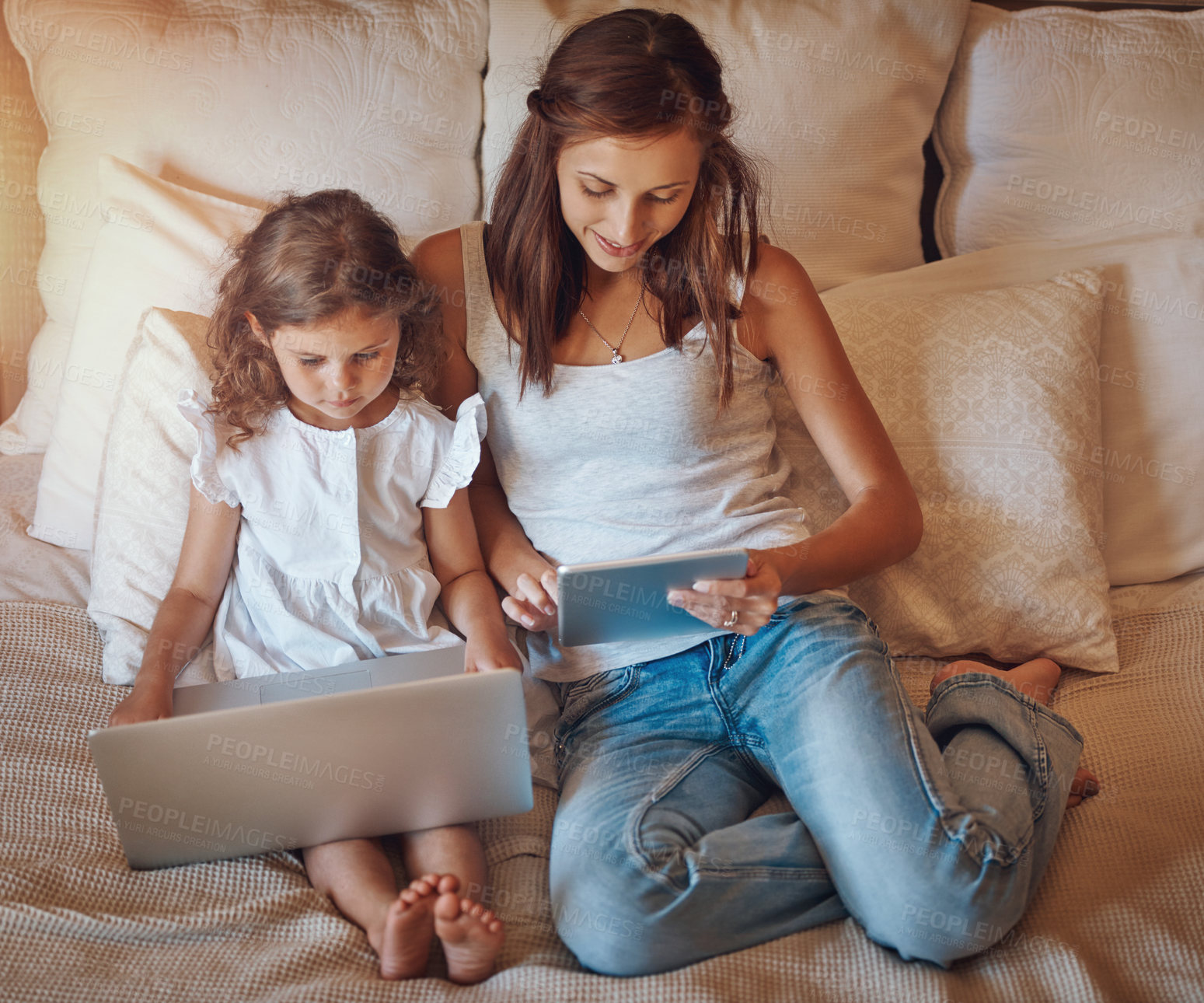 Buy stock photo Mom, girl and technology in home for streaming movies, bonding and top view on bed together. Woman, child and laptop in apartment for tv show, cartoon or social media with relax and subscription