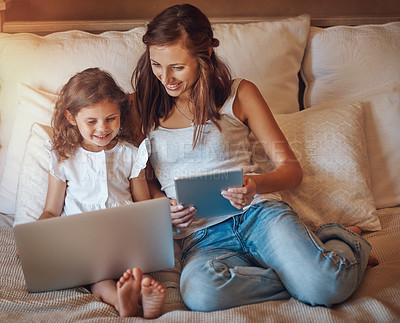 Buy stock photo Mother, girl and technology in home for streaming movies, bonding and relationship together on bed. Mom, child and laptop in apartment for tv show, cartoon or social media with relax and subscription