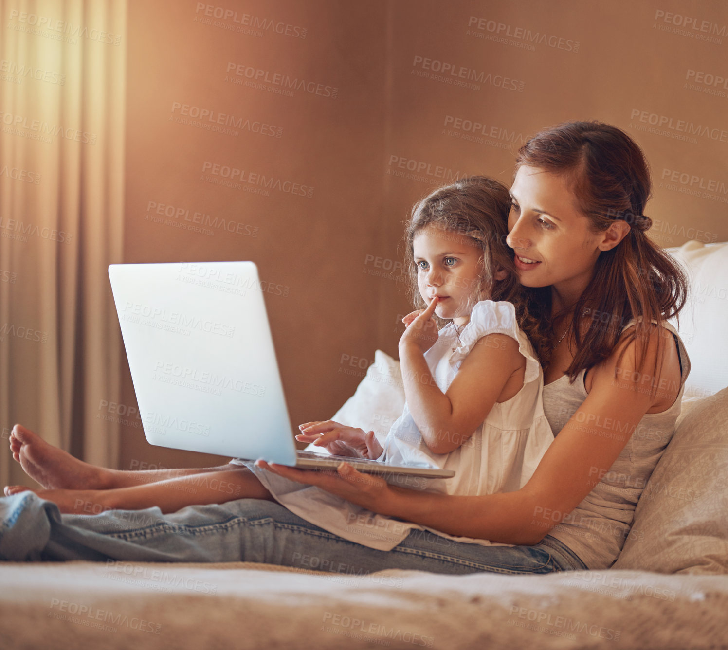 Buy stock photo Mom, girl and technology in home for cartoon streaming, bonding and relationship together on bed. Woman, child and laptop in apartment for tv show, movies or social media with relax and subscription