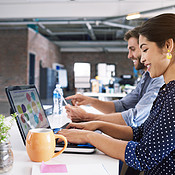 Hard at work on their latest designs | Buy Stock Photo on PeopleImages ...