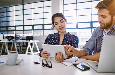 Buy stock photo Internet, tablet and woman with man in office sharing idea or opinion at meeting for creative project. Team, social media and employees in startup discussion at design agency for content marketing.