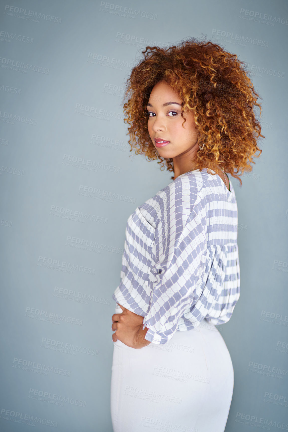 Buy stock photo Studio shot of a young businesswoman against a gray background