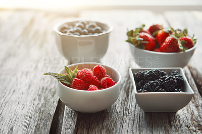 Buy stock photo Bowls, berries and health on table, kitchen and organic choice for nutrition, breakfast and salad for wellness. Fruits, raspberry and mulberry in home with container, meal prep and food in morning