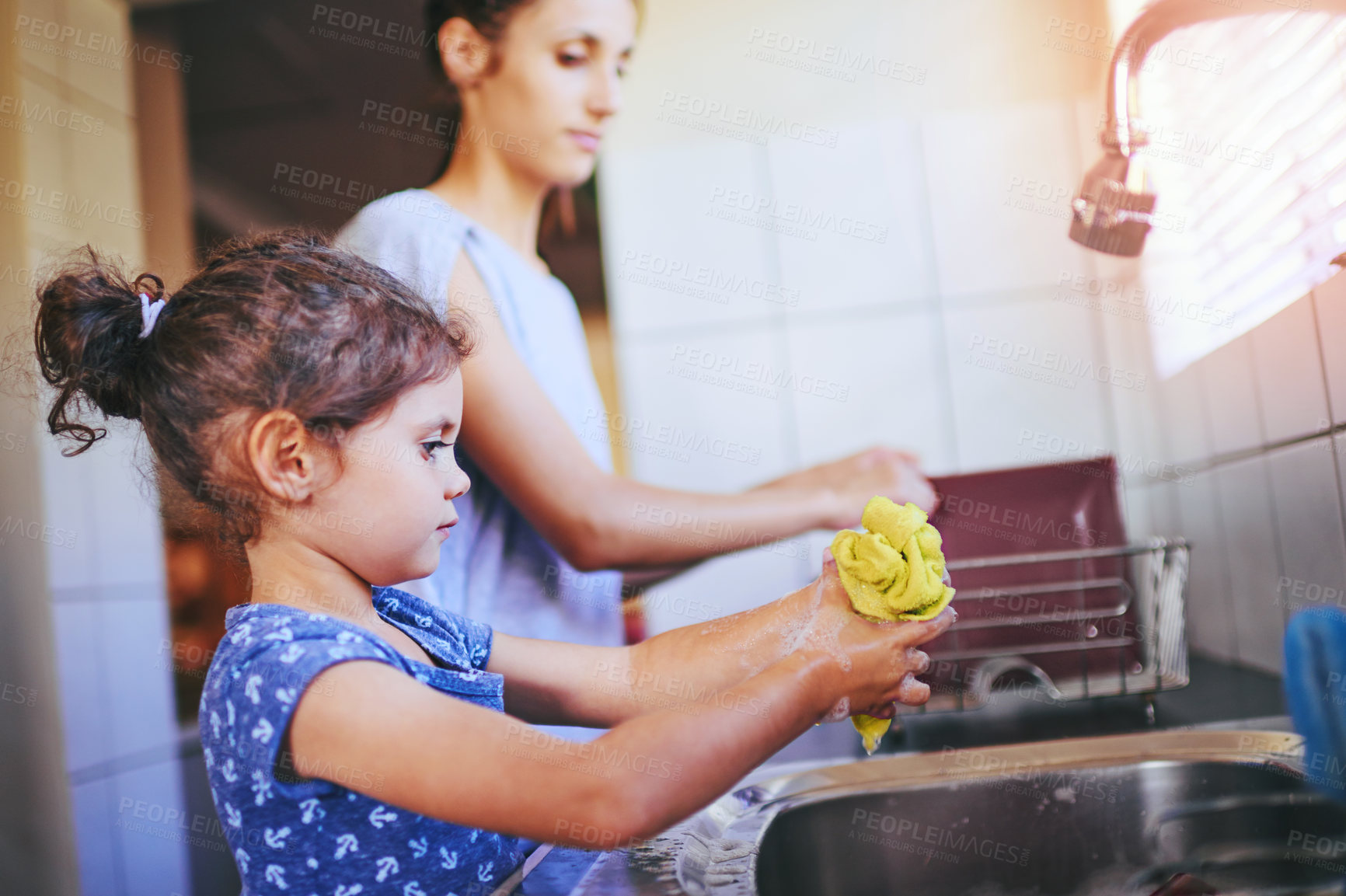 Buy stock photo Mom, child and wash cloth with learning in kitchen with cleaning, teaching and help in a family home. Water, happy and love of parent and young girl together with bonding, support and sink with care