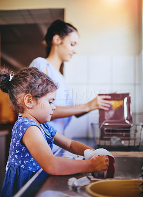 Buy stock photo Mom, child and washing dishes with soap in kitchen with cleaning, teaching and help in family home. Learning, happy and love of parent and young girl together with bonding, support and sink with care