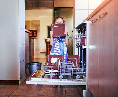 Buy stock photo Home, kitchen and portrait of child by dishwasher for hygiene, responsibility and learning to clean. Shy, girl and face with plate by electrical appliance for packing, life skills and weekend chores