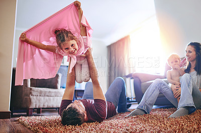 Buy stock photo Happy, child and man with airplane in living room for playful, fun and bonding together on weekend. Family love, father and daughter with cloth on floor for imagination, fantasy and pretending to fly