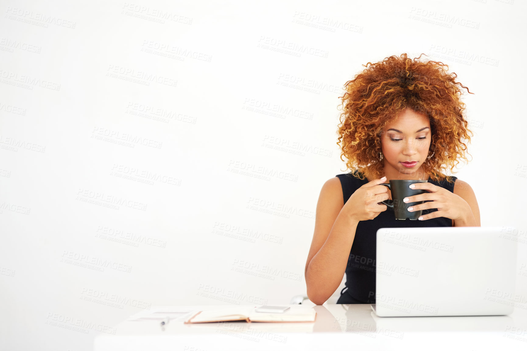 Buy stock photo Woman, laptop and coffee in studio by space for mock up with thinking by white background. African person, computer and drink in tea cup with reading, research and notebook for job at creative agency