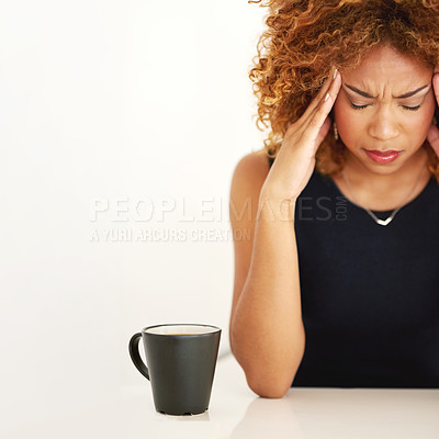 Buy stock photo Shot of a young businesswoman suffering from a headache at work