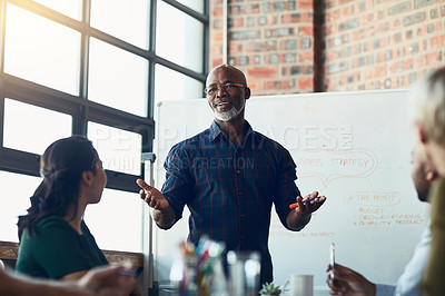 Buy stock photo Business man doing presentation, planning and talking in a meeting, seminar or training conference in a boardroom at work. Employees listening to a manager, making plans and working together