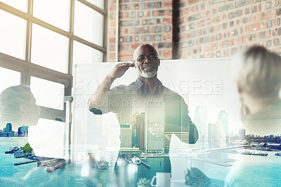 Buy stock photo Cropped shot of a mature businessman giving a presentation in the boardroom superimposed over a waterfront