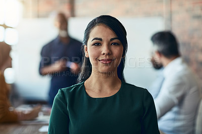 Buy stock photo Cropped portrait of a young businesswoman sitting in the boardroom during a presentation