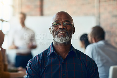 Buy stock photo Mature business man sitting in a meeting, conference or seminar in a boardroom with colleagues at work. Closeup portrait of face of a senior, happy and corporate professional in a training workshop