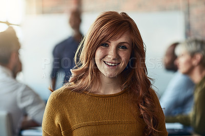 Buy stock photo Cropped portrait of a young businesswoman sitting in the boardroom during a presentation