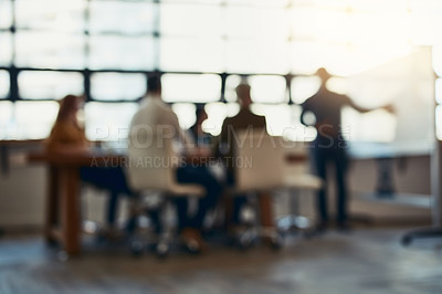 Buy stock photo Full length bokeh shot of a group of corporate businesspeople meeting in the boardroom