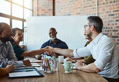 Buy stock photo Business people, meeting and handshake for deal, agreement and collaboration. Smile, shaking hands and employees in partnership, congratulations or b2b, group acquisition and thank you in office.