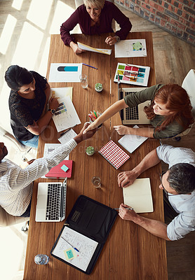 Buy stock photo Handshake, agreement and greeting team of creative designers during a meeting working together. Overhead view of a diverse group of artists or creators planning for a design business or company