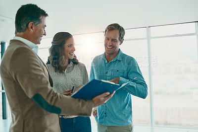 Buy stock photo Shot of a group of businesspeople discussing ideas in the new office space for the business and future