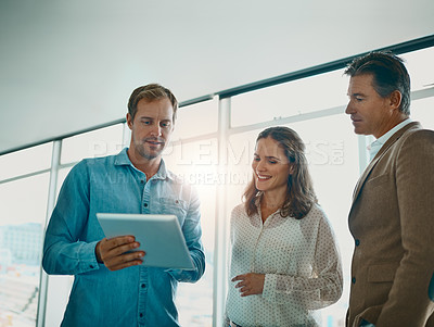 Buy stock photo Shot of a group of businesspeople discussing ideas in the new office space for the business and future