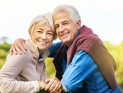 Buy stock photo Portrait of a happy senior couple relaxing on a park bench
