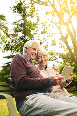 Buy stock photo Video call, park and senior couple with a tablet for communication, 5g internet and a movie. Nature, hug and elderly man and woman with technology for social media and reading an email in Argentina