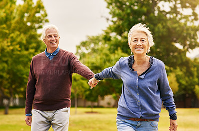 Buy stock photo Old couple holding hands, outdoor in park and smile, happiness with freedom in nature, love and retirement. Happy, man and woman with travel, relationship with trust in marriage and commitment