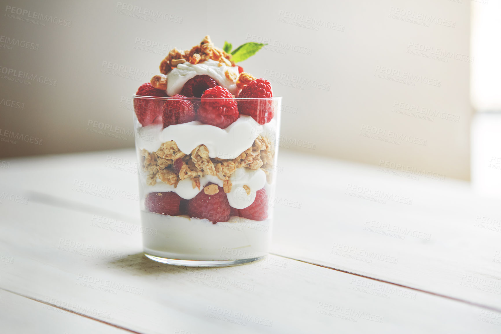 Buy stock photo Shot of granola, yoghurt and berries in a glass